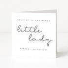 Greeting card with 'Welcome to the world little lady' text on a white background