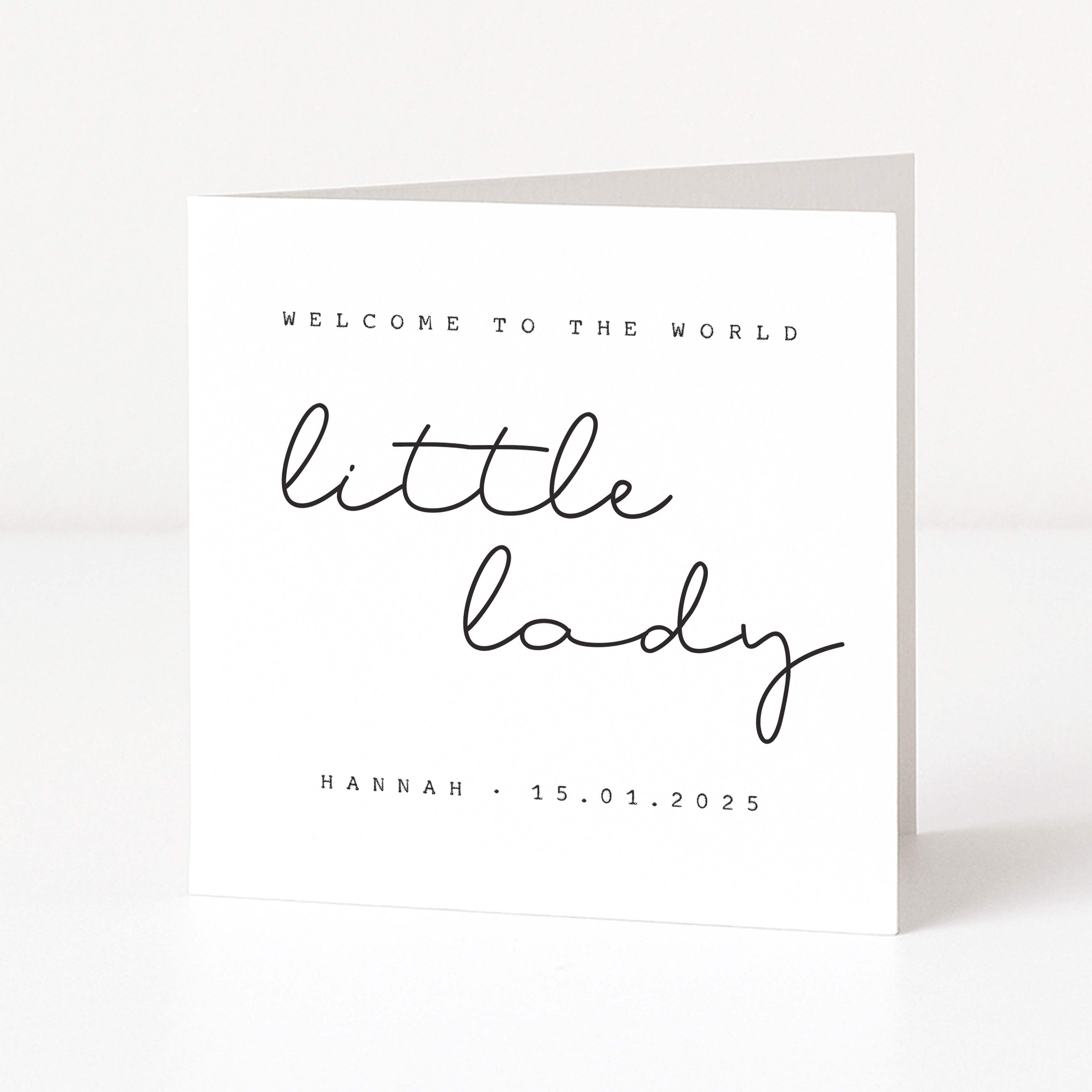 Greeting card with 'Welcome to the world little lady' text on a white background
