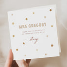 white card being held in hand with florals decoration and personalised passage