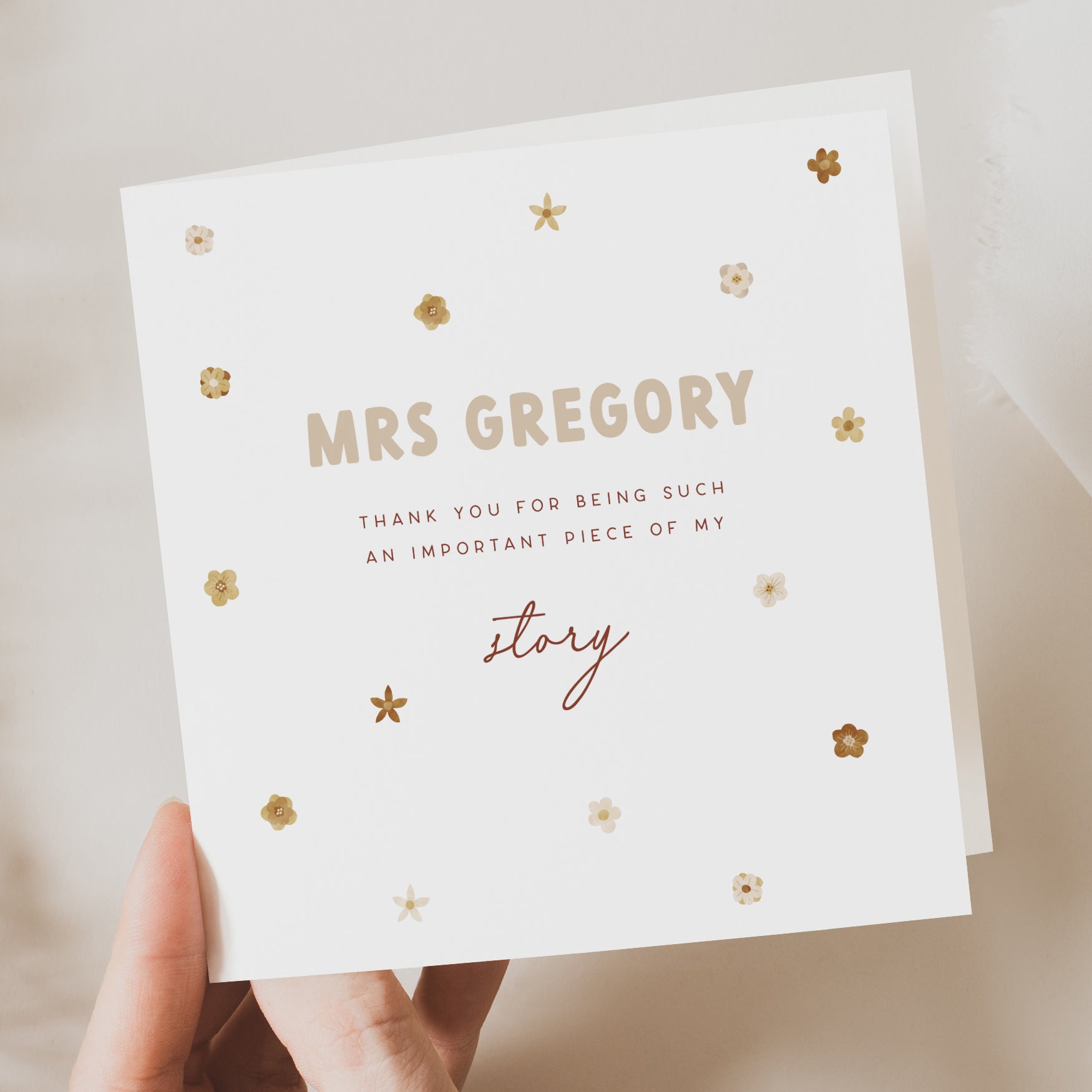 white card being held in hand with florals decoration and personalised passage