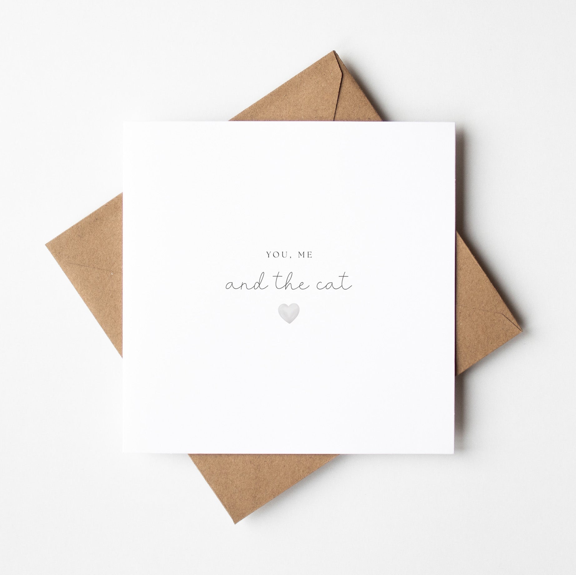 White card with 'You, Me and the Cat' text and a heart symbol on a brown envelope.