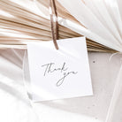White card with 'Thank you' text hanging on dried plants