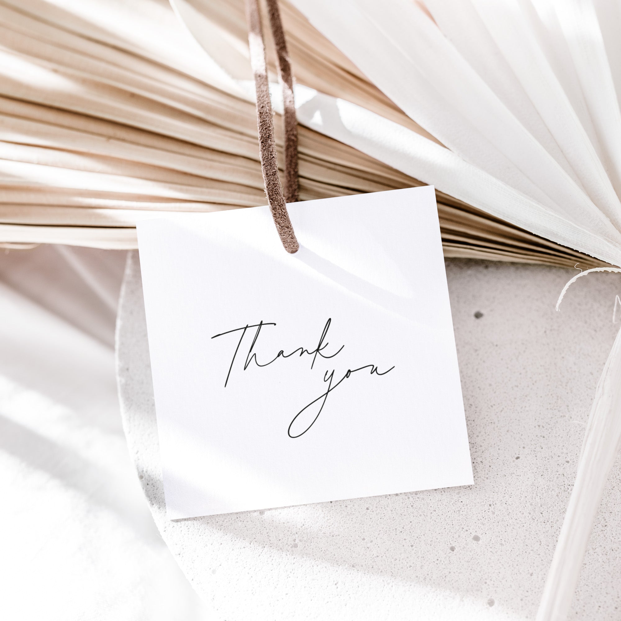 White card with 'Thank you' text hanging on dried plants
