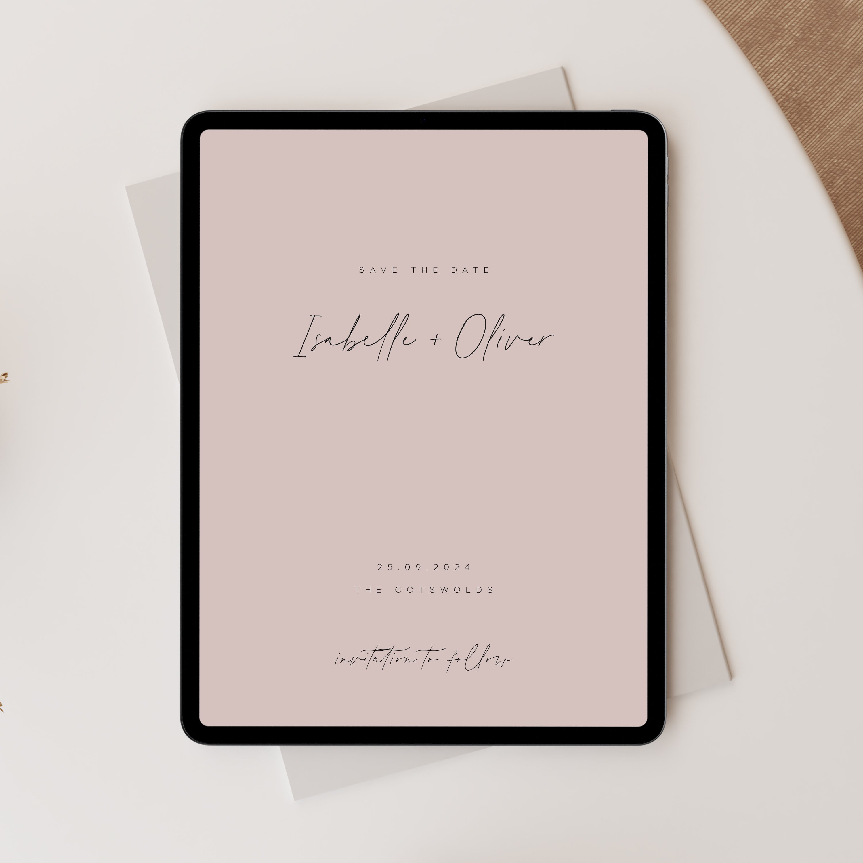 Pink digital save the date for wedding on tablet