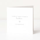 White card with black text and a heart symbol on a white background