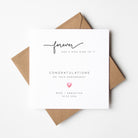 Engagement card with 'forever has a nice ring to it' text and a heart symbol, placed on a white background.