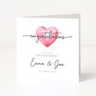 Engagement card with a pink heart and personalized text on a white background