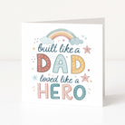Father's Day card with colorful text 'built like a dad, loved like a hero' and decorative elements on a white background