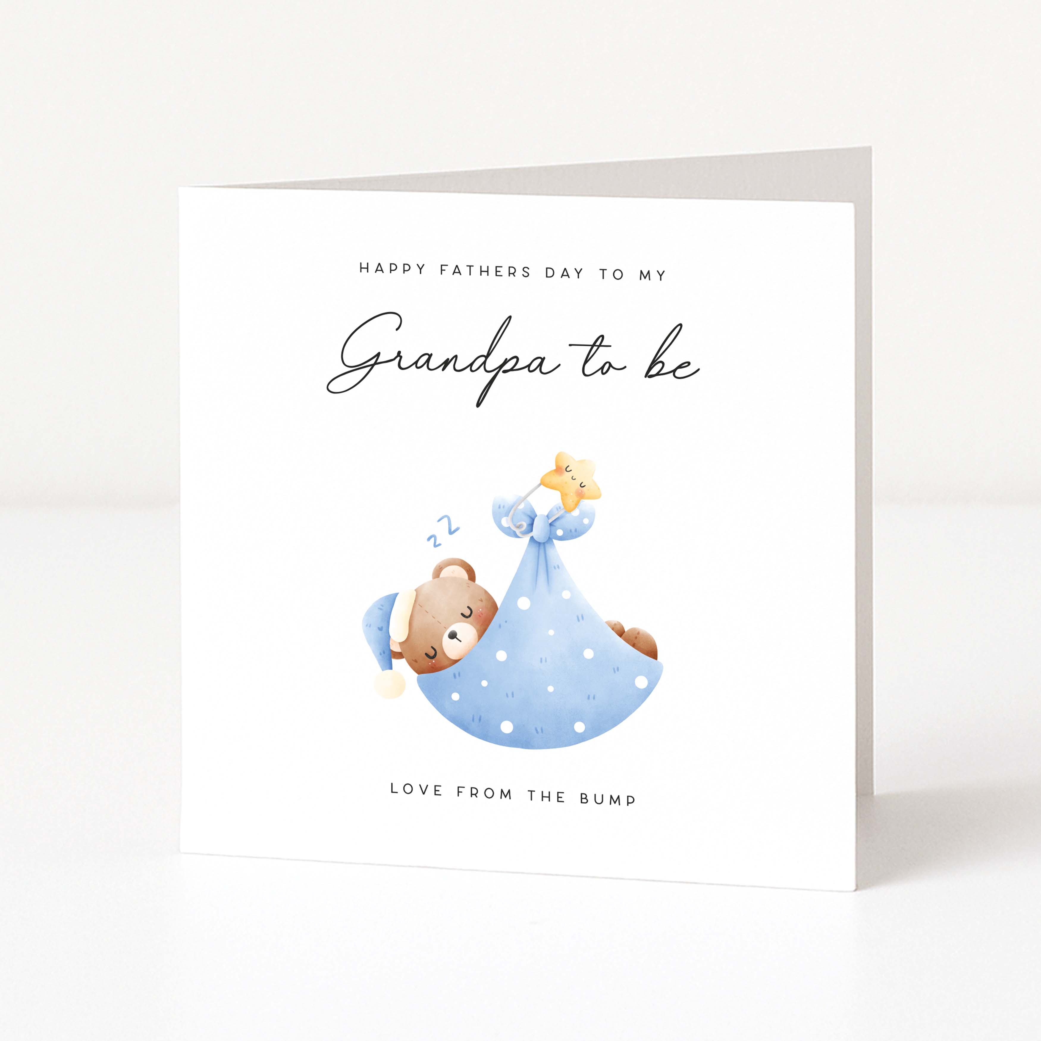 Greeting card for a grandpa to be with a baby bear illustration and text on a white background