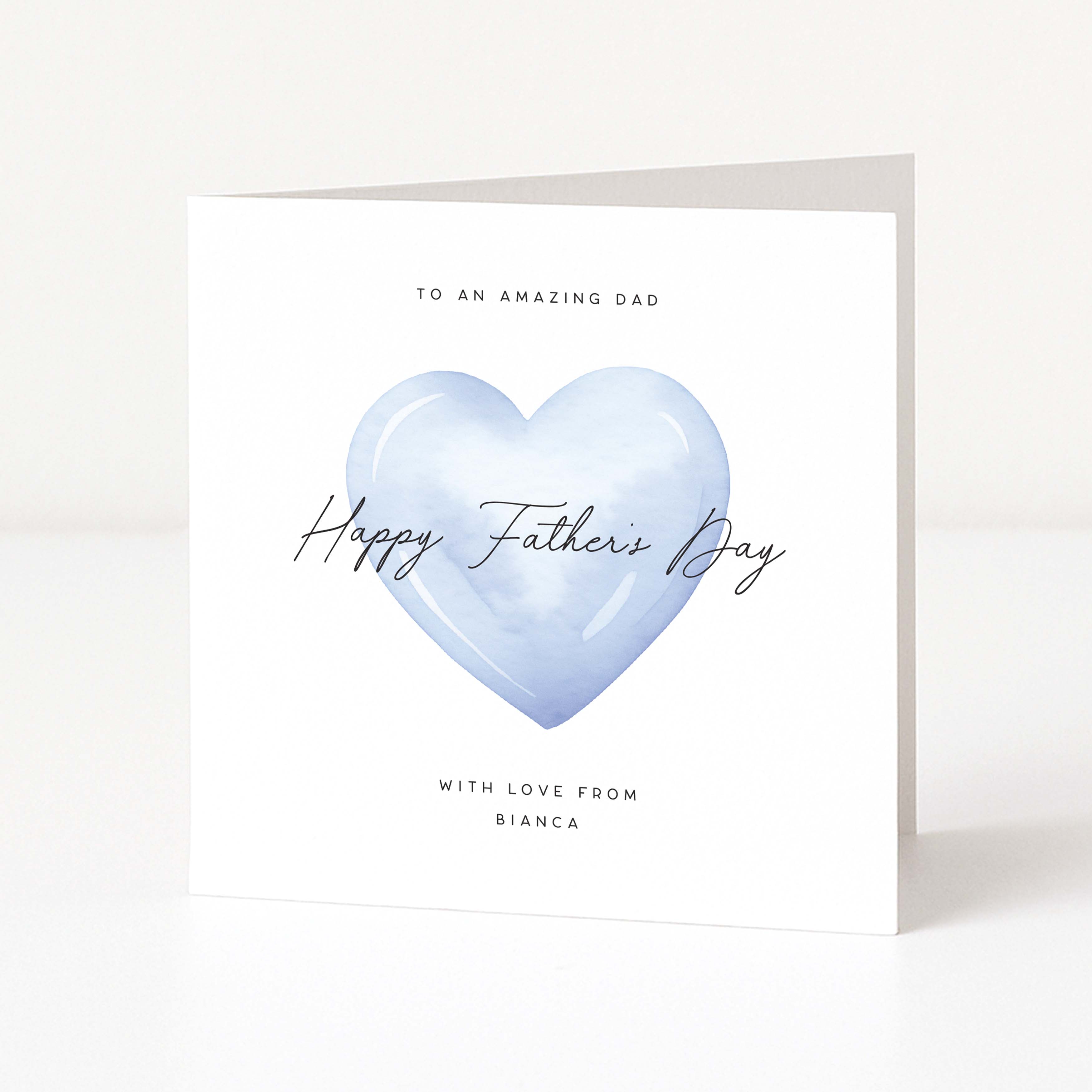 Greeting card with a blue heart and personalised text for Father's Day on a white background