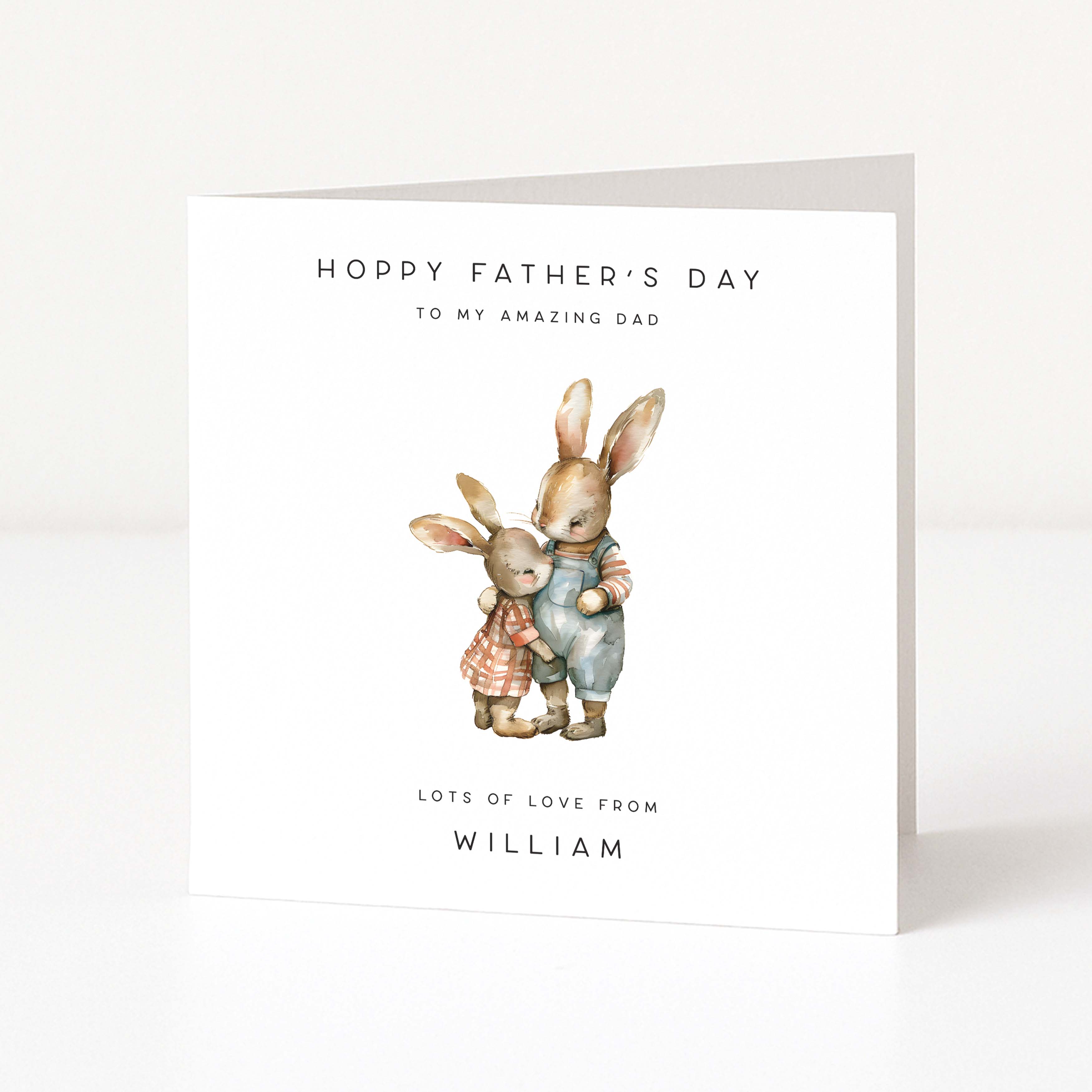 Cute personalised Father's Day card with two rabbits hugging and text on a white background