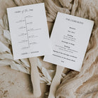 classic wedding programme paddle fan with wooden handles on a natural background