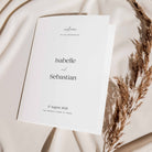 Wedding folded order of service  with text on a soft beige background