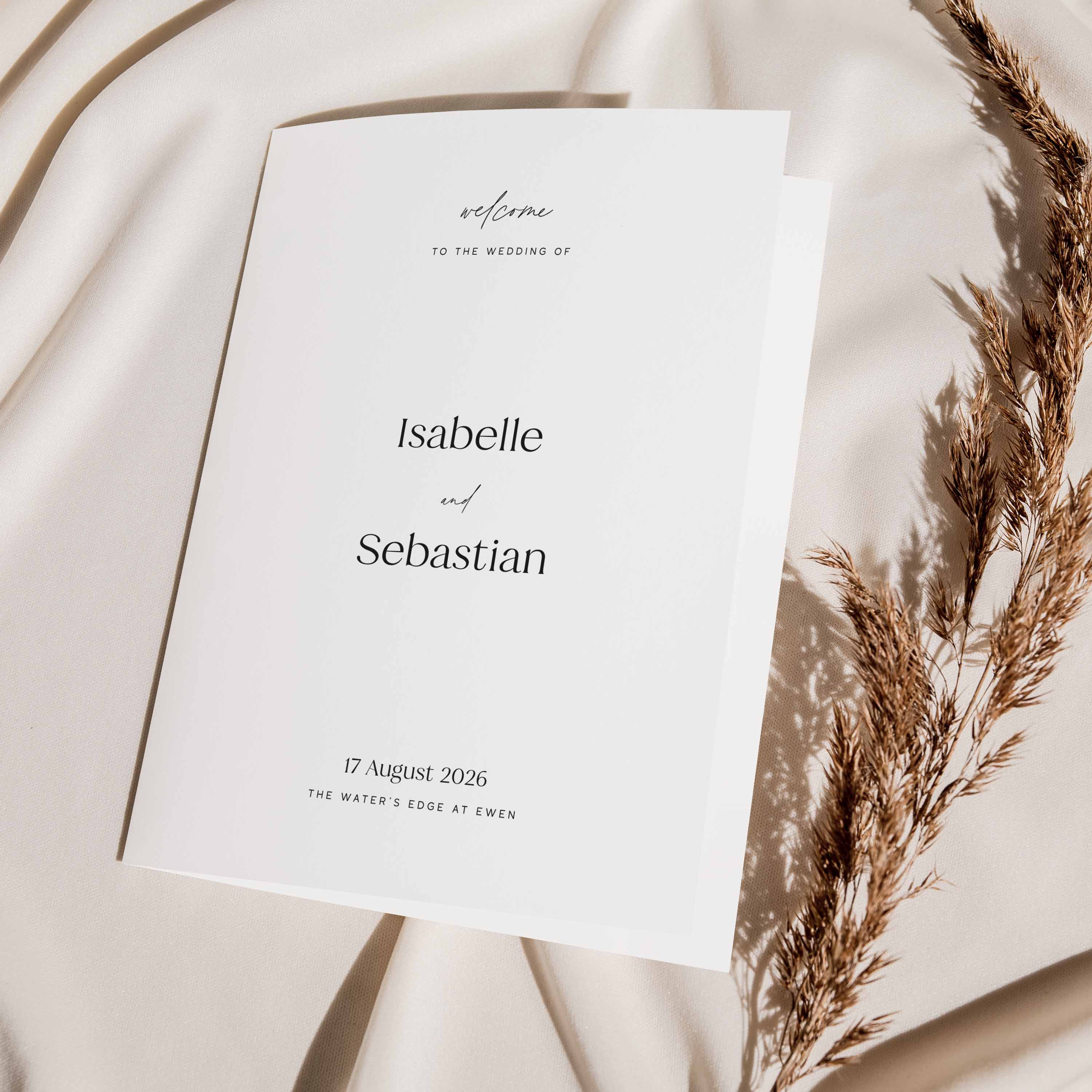 Wedding folded order of service  with text on a soft beige background