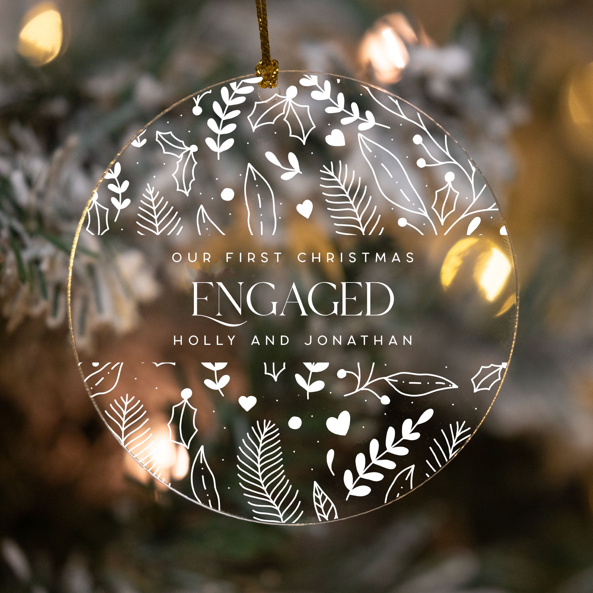 Decorative ornament with 'Our First Christmas Engaged' text on a Christmas tree background