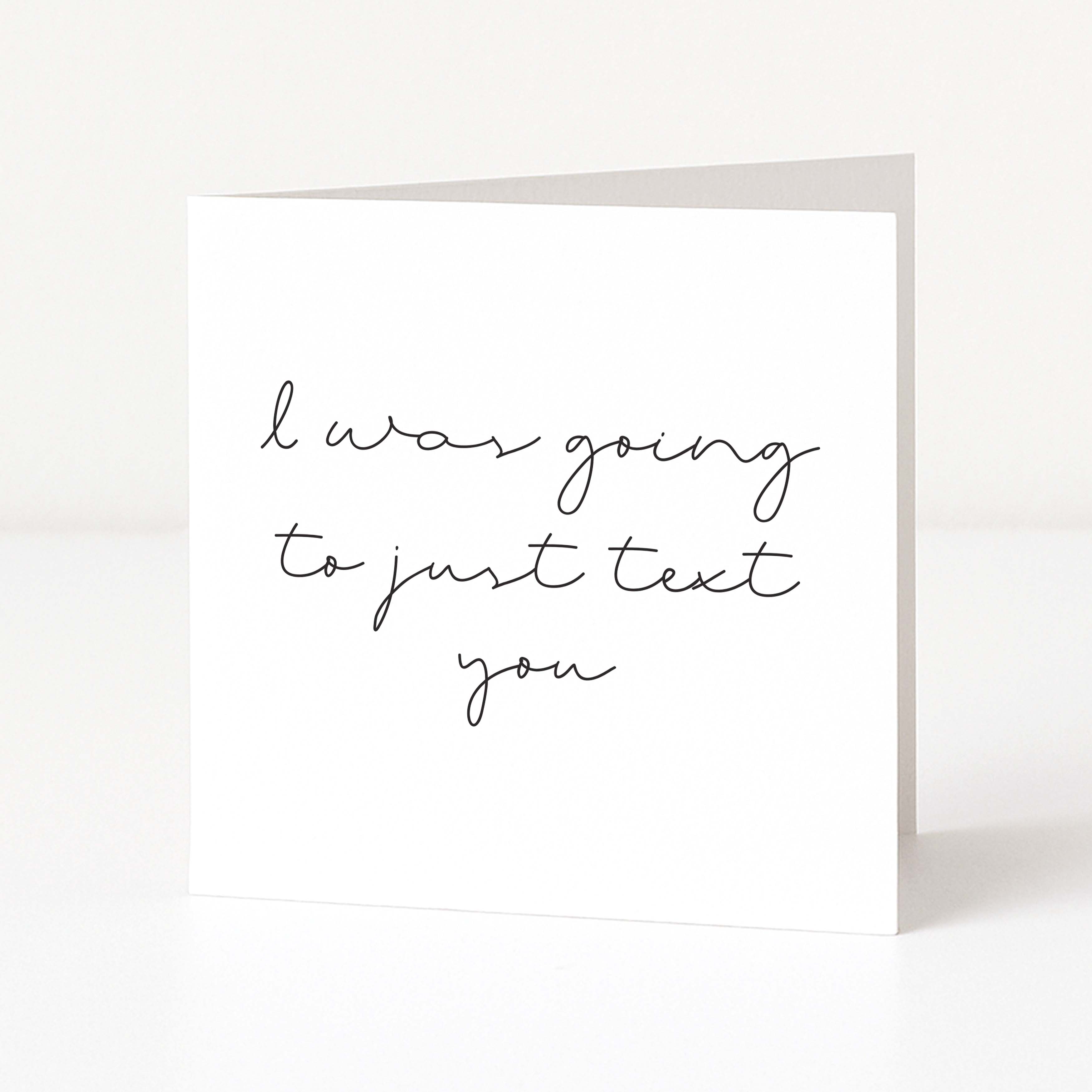 Greeting card with text 'I was going to just text you' on a white background