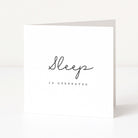 White greeting card with 'Sleep is overrated' text on a white background