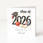 Graduation-themed card with 'class of 2026' text and graduation cap, apple, and books on a white background.