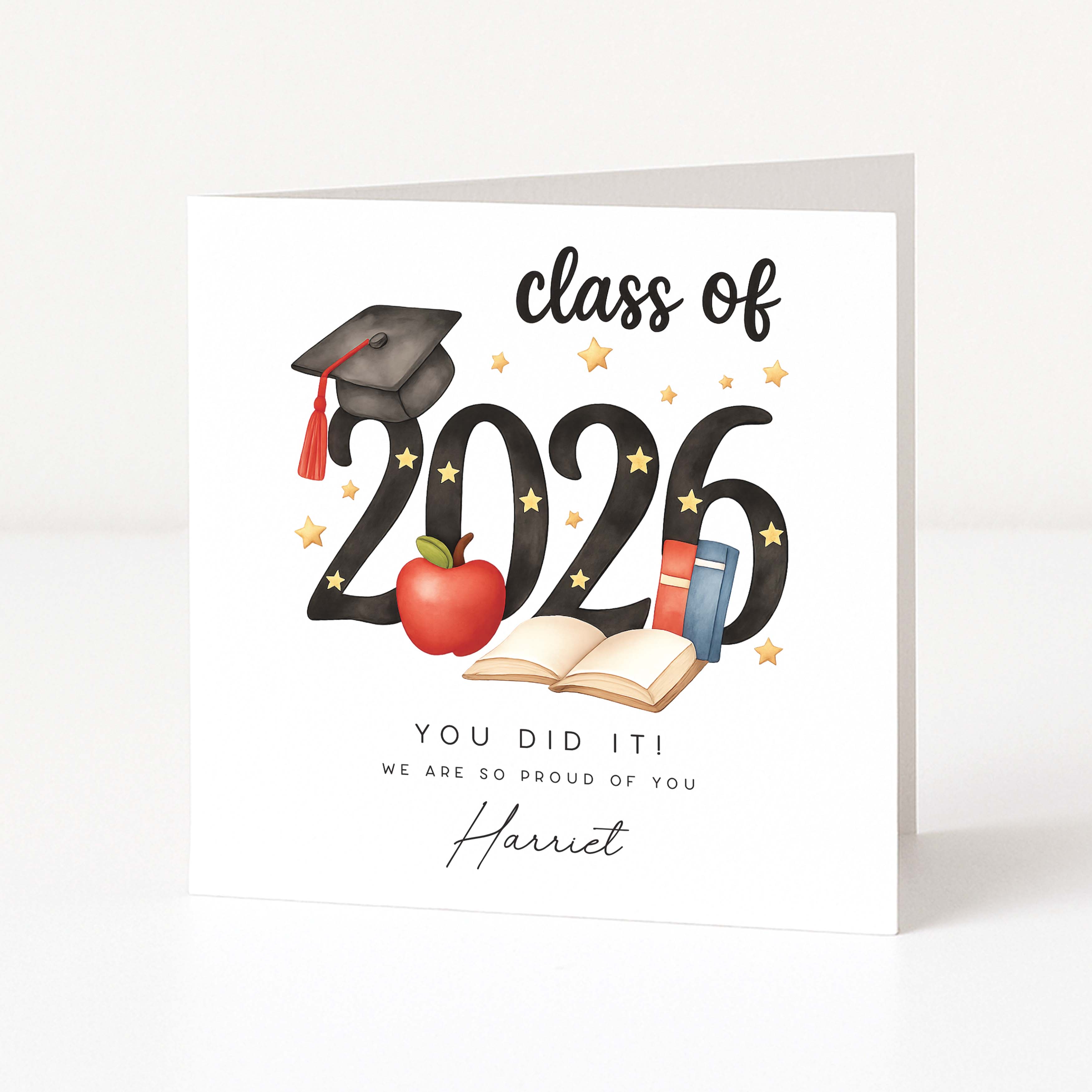 Graduation-themed card with 'class of 2026' text and graduation cap, apple, and books on a white background.