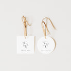 Two white tags with 'THANK YOU' and a logo on a light beige background