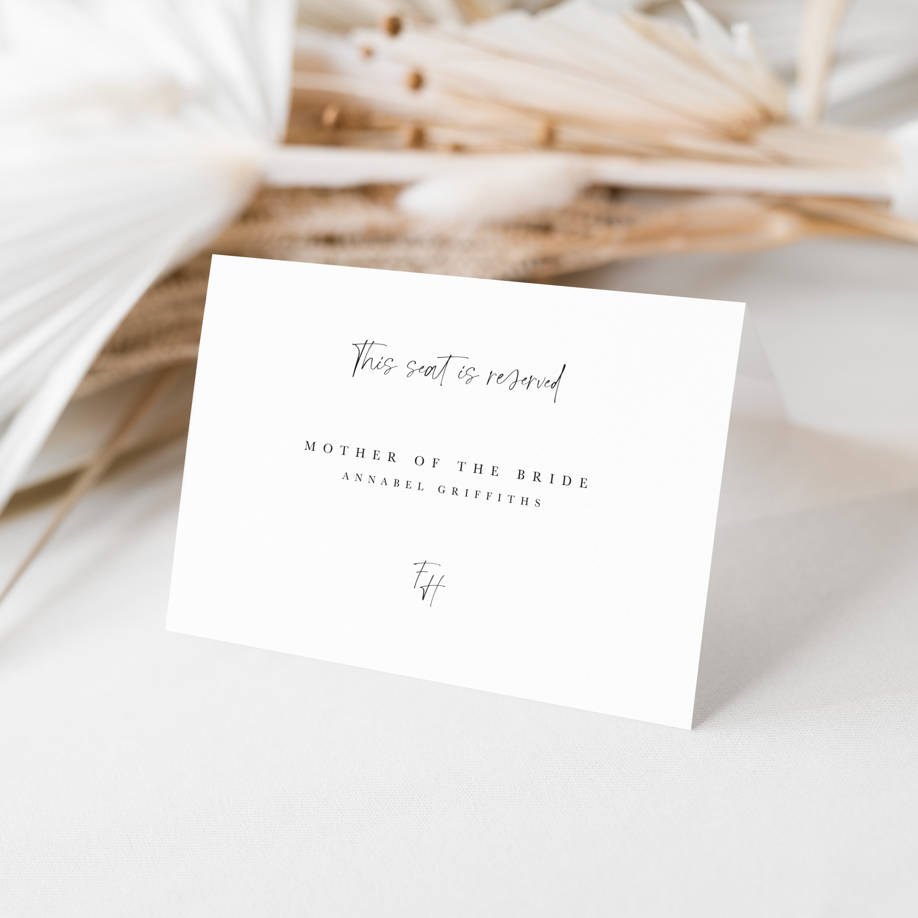 Seat reservation card for wedding with text on a light background