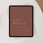 Save the Date card on a tablet with a terracotta background