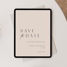 Digital tablet displaying a 'Save the Date' wedding invitation on a light surface.