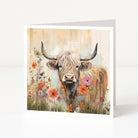 Greeting card with a painted bull surrounded by flowers on a white background