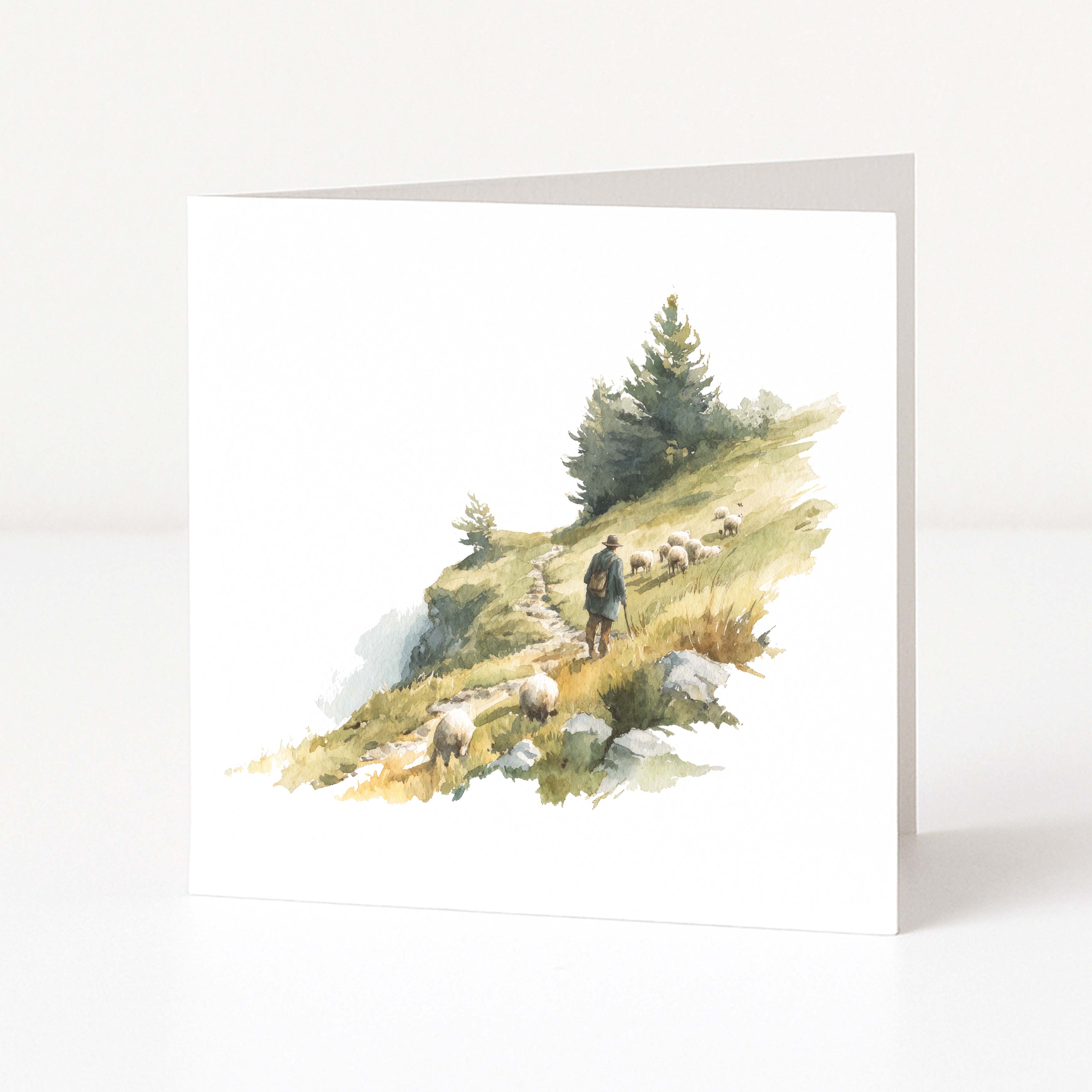 Greeting card with a scenic illustration of a shepherd and sheep on a hillside.