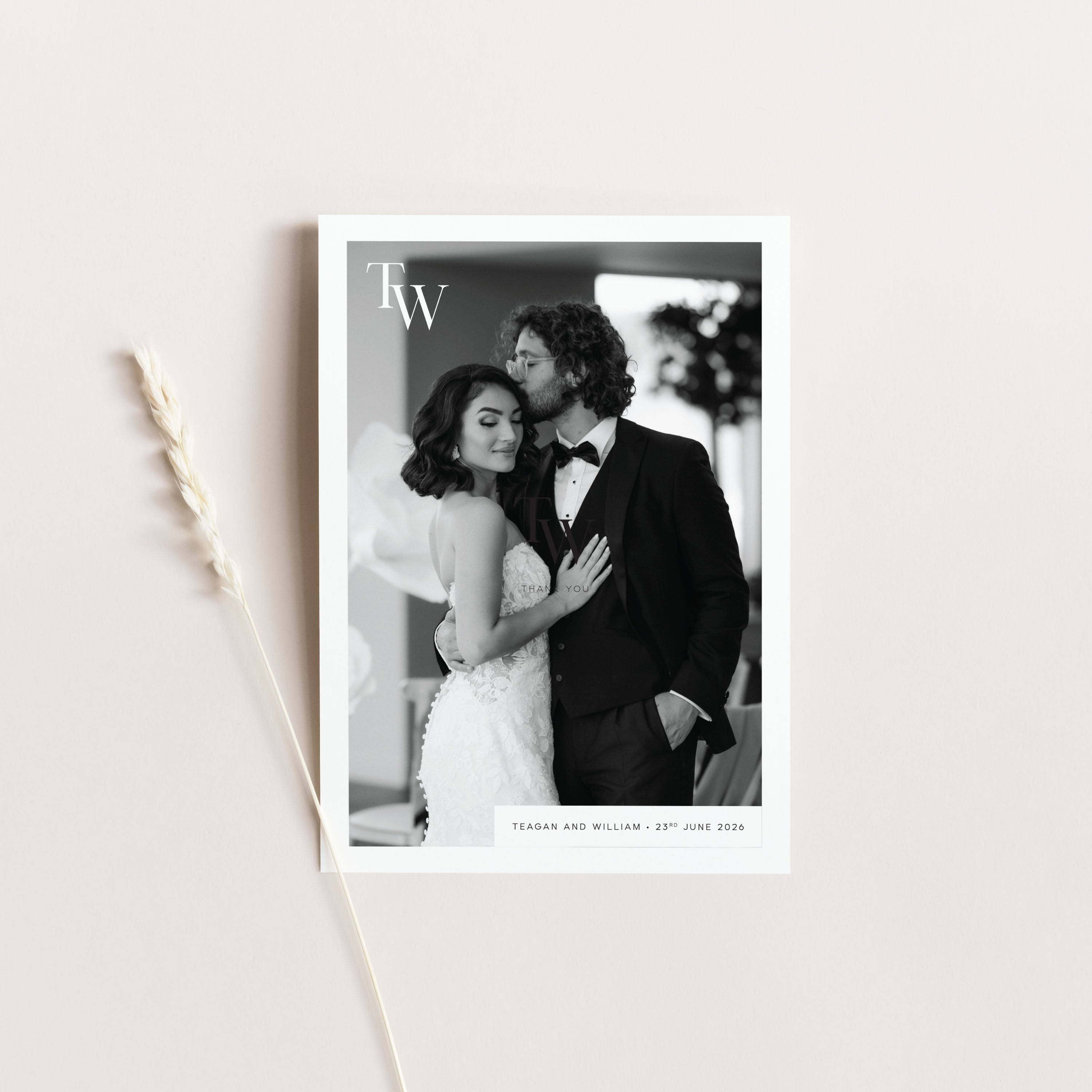 Black and white photo of a couple on a thank you card with 'TW' initials and text.