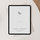 Digital tablet displaying a 'Save the Date' invitation with initials TW on a light surface.