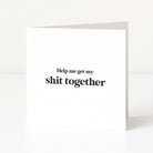 white card saying "help me get my shit together" on white background