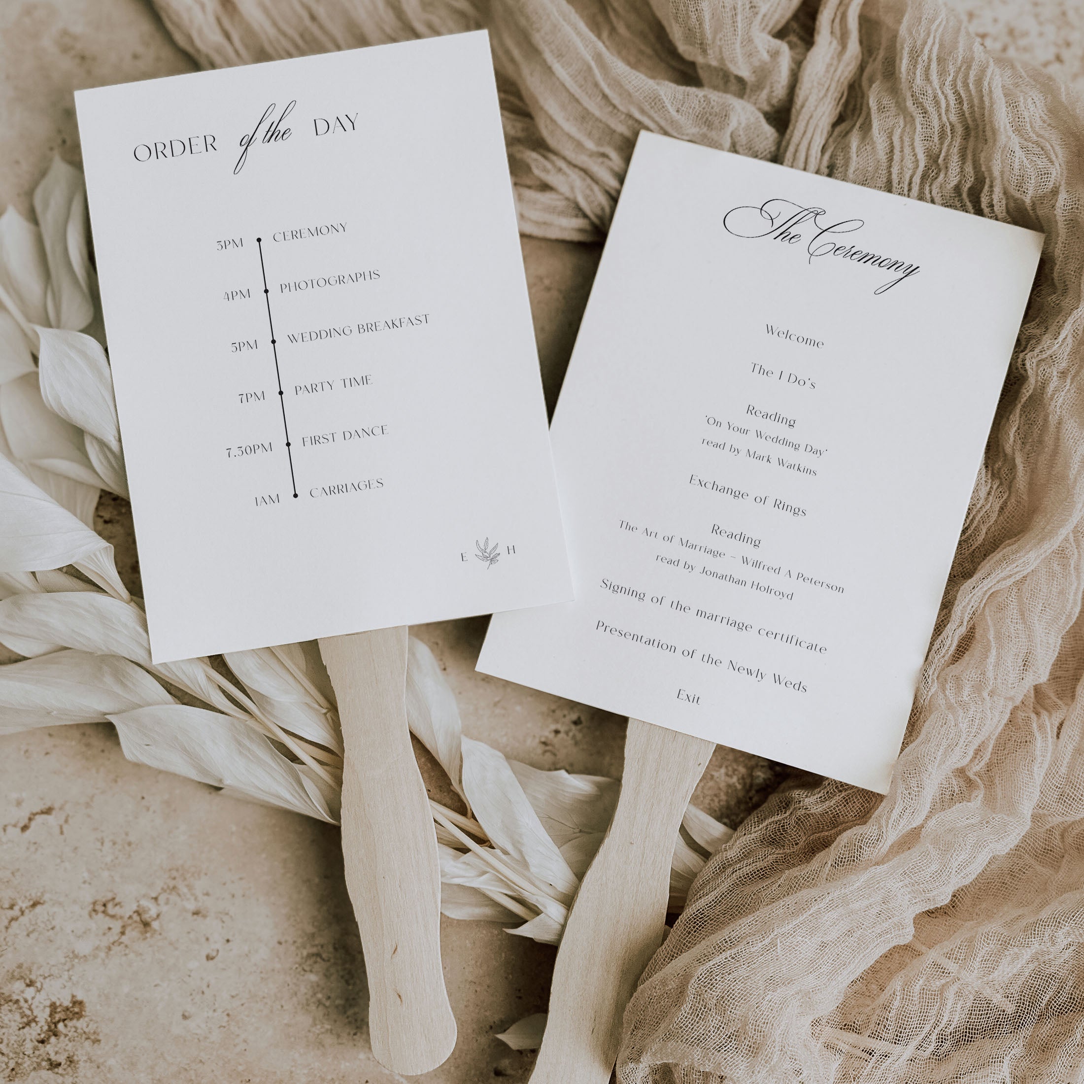 paddle fans for wedding with wedding programme printed double sided with wooden handles on a neutral background
