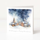 A Christmas card showing a watercolour starry village scene and "wishing you a merry christmas" text
