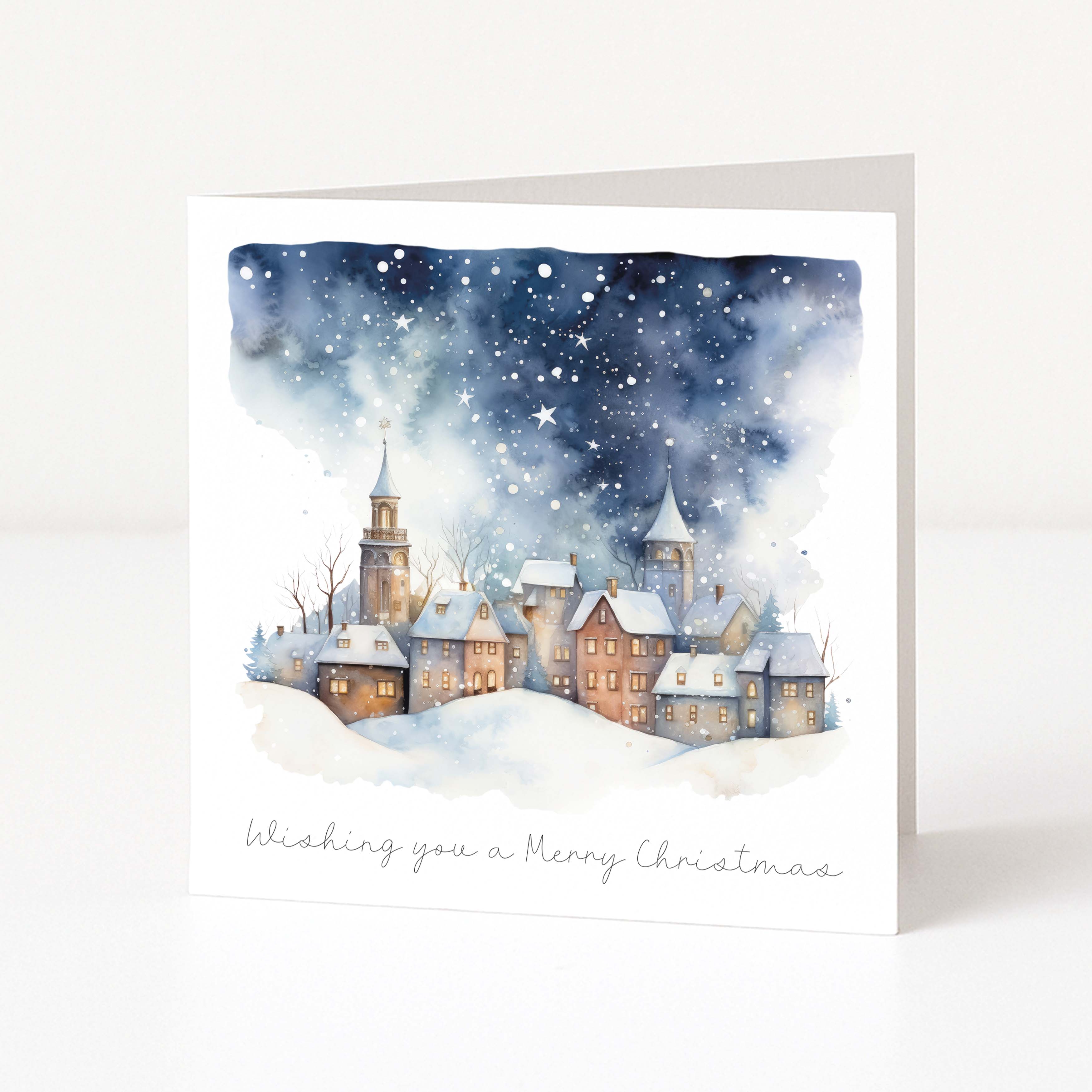 A Christmas card showing a watercolour starry village scene and "wishing you a merry christmas" text