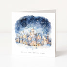 Greeting card with a winter village scene and starry sky on a white background