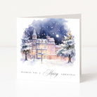 Christmas card with a snowy scene of a house and trees, featuring the text 'Wishing you a Merry Christmas'.