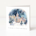 Christmas card with a snowy village scene and text 'It's the most wonderful time of the year' on a white background.