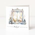 A Christmas card showing a vintage window accompanied with Christmas and snowy artwork features and "It's the most wonderful time of the year" printed underneath.