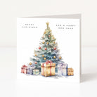 A square Christmas greeting card with a watercolor illustration of a decorated tree and wrapped presents, with the text 'MERRY CHRISTMAS AND A HAPPY NEW YEAR' on a white background.