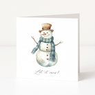 A white Christmas greeting card featuring a watercolour illustration of a snowman wearing a brown top hat and a blue-grey plaid scarf, with the text 'Let it snow!' printed below.