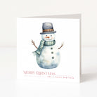 A white Christmas greeting card featuring a watercolor illustration of a snowman wearing a gray top hat and green scarf, with the text 'MERRY CHRISTMAS AND A HAPPY NEW YEAR' printed below.