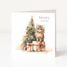 A square greeting card shown standing upright against a clean white background. The card features a watercolour illustration of a fluffy brown cat sitting on wrapped presents beside a decorated Christmas tree, with the text 'Meowy Christmas' printed on the front.