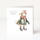 A white Christmas greeting card featuring an illustration of a duck wearing winter clothing and ice skates, with the text 'have yourself a christmas quacker' printed on the front.