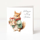 A square Christmas greeting card featuring a watercolour illustration of a squirrel wearing a green sweater and red scarf while holding a wrapped gift box. The right side has the text 'Wishing you a Merry Christmas' in black script.