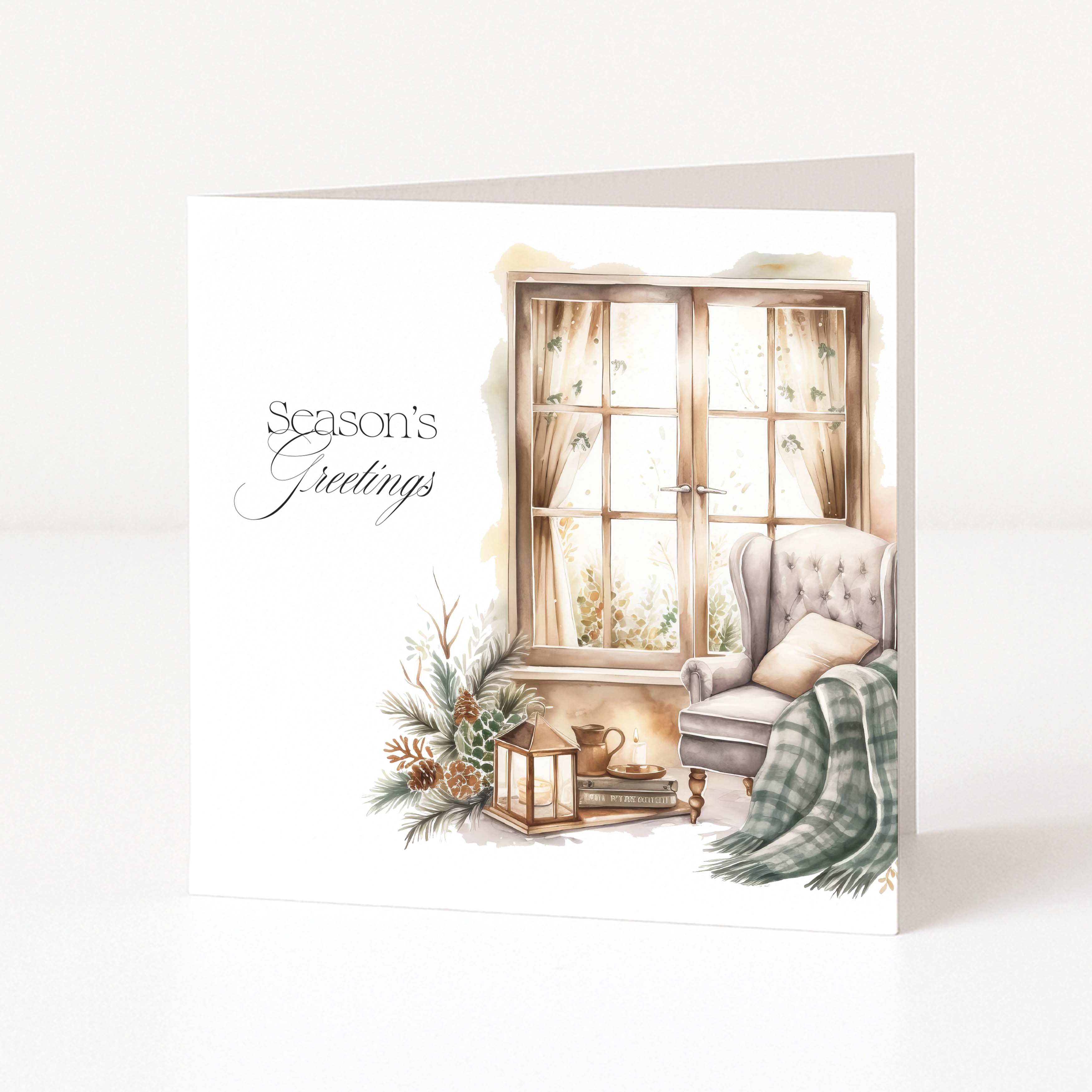 A square Christmas card with a watercolour-style illustration of a cozy window scene, featuring the text 'Season's Greetings' on a white background.
