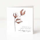 A square white greeting card standing upright, printed with a watercolour-style botanical illustration of cotton buds and the text 'Wishing you a Merry Christmas and a happy new year' on a clean white background.