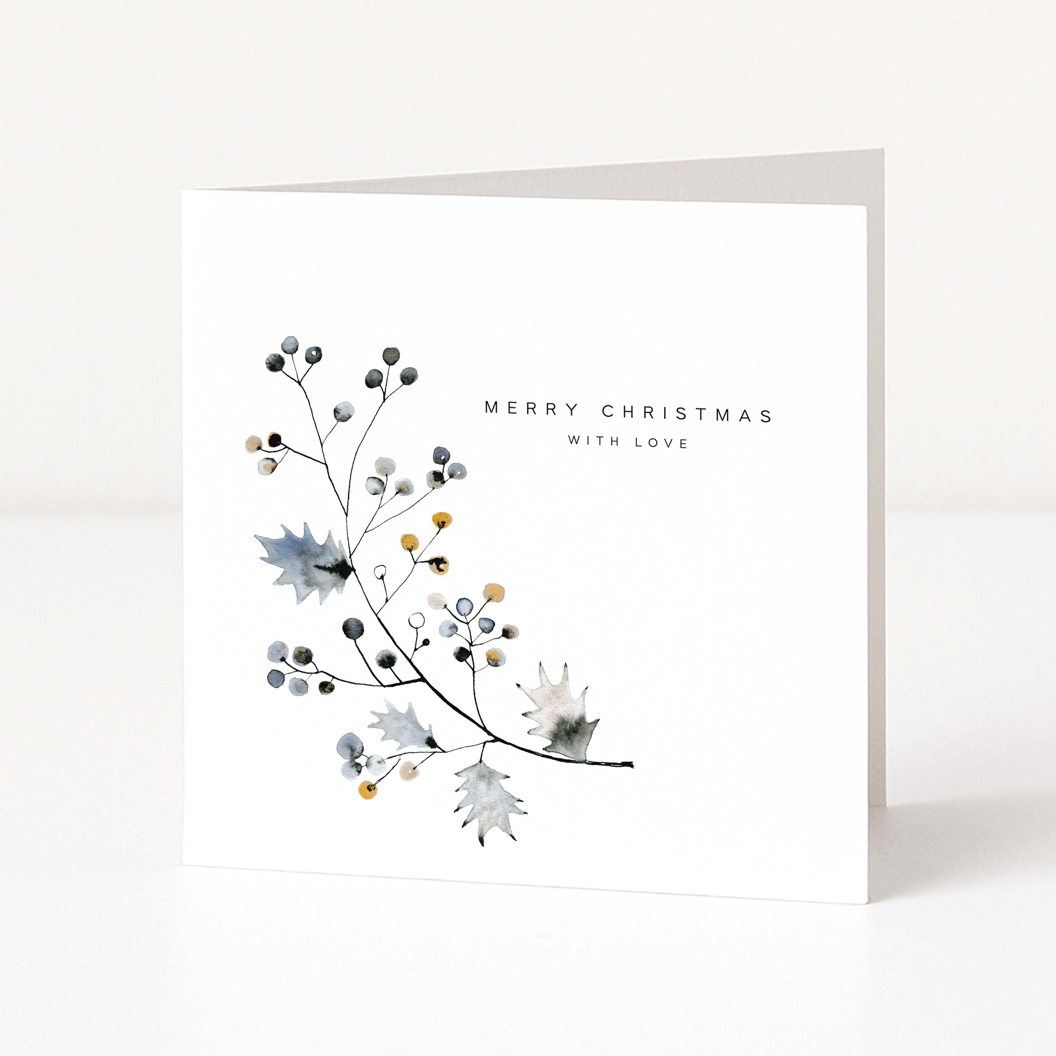 A square white Christmas greeting card standing upright on a white surface, featuring delicate watercolour botanical branches in muted blue, grey, black, and small gold accents, with the text 'MERRY CHRISTMAS WITH LOVE' printed on the front.