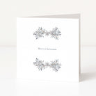 A white square Christmas greeting card standing upright on a white surface, with two delicate grey and silver leafy garlands and the words 'Merry Christmas' centered on the front.