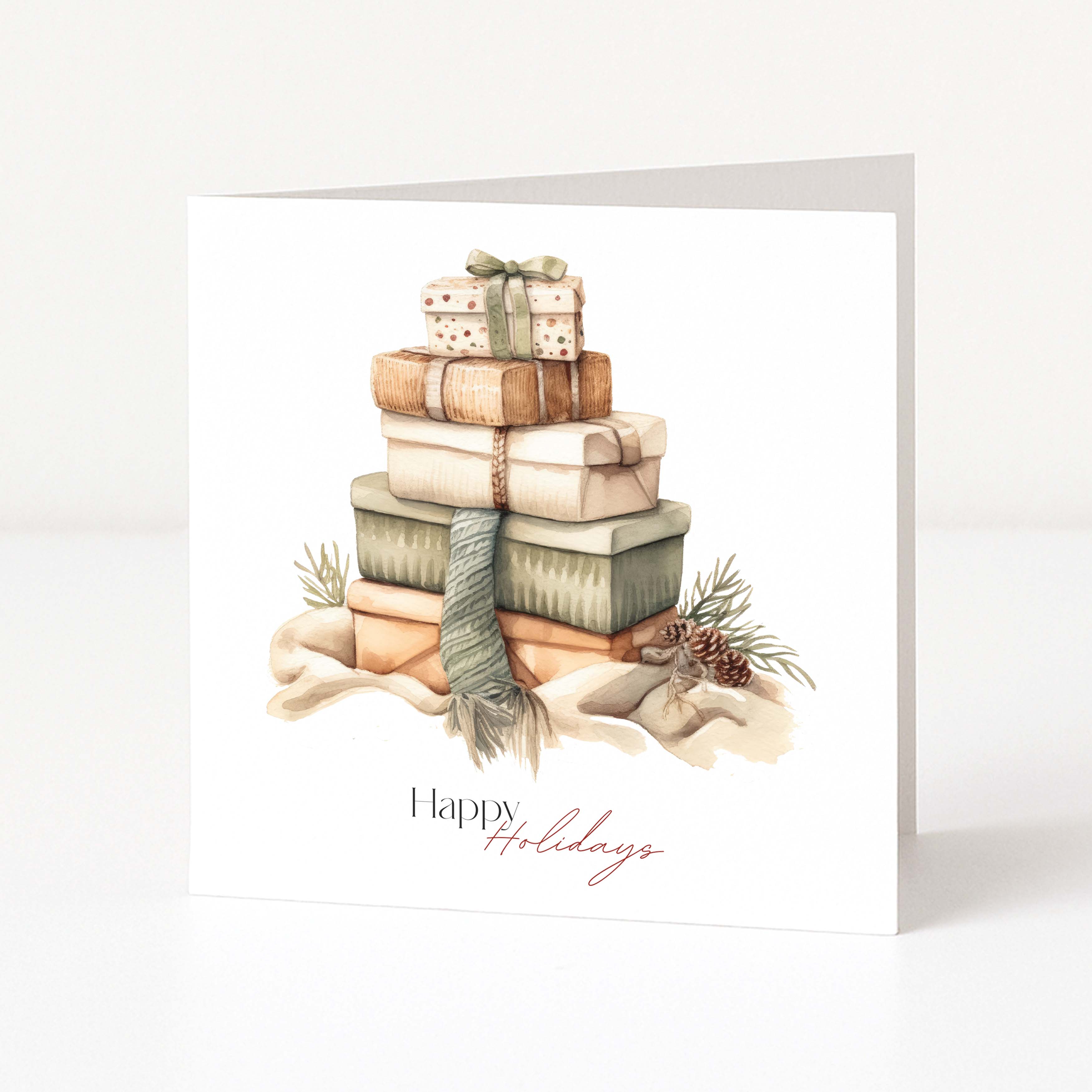 A white square Christmas greeting card standing upright on a light grey surface. The front features an illustrated stack of wrapped gift boxes in muted beige, brown, green, and cream tones, with pinecones and the words 'Happy Holidays' printed near the bottom.